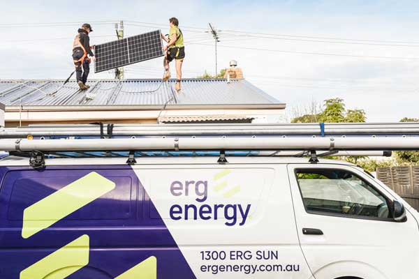Erg Energy van below a rooftop solar installation